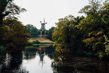 Beautiful windmill park and lake in the city of Bremen at evening
