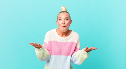 pretty blond woman amazed, shocked and astonished with an unbelievable surprise