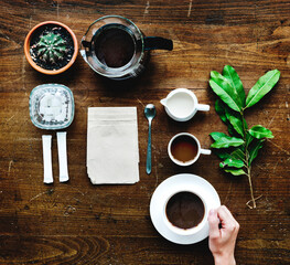 Aerial view of coffee setting on wooden table