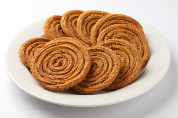 Indian Traditional Tea Time Snack Chakli, a deep fried snack, It is known as Chakali, Murukku, Muruku, Murkoo, Chakri.
