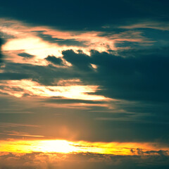 sunset behind a cloud