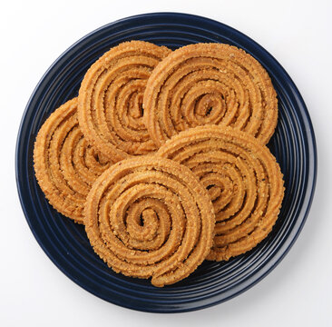 Indian Traditional Tea Time Snack Chakli, a deep fried snack, It is known as Chakali, Murukku, Muruku, Murkoo, Chakri.

