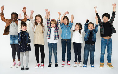 Obraz premium A group of primary schoolers cheering