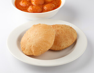 Indian food - Puri Bhaji. North India. Puri is a deep fried bread made from whole wheat flour & Served with Potato curry , bhaji or alu ki sabji.or Potato curry or dum alu curry
