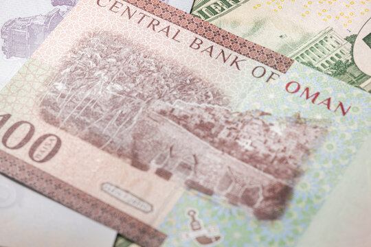 Close up to 100 Baisa of the Arabic country oman. Paper banknotes of the Arabian country. Detailed capture of the reverse art design. Detailed money background wallpaper. Currency bank note
