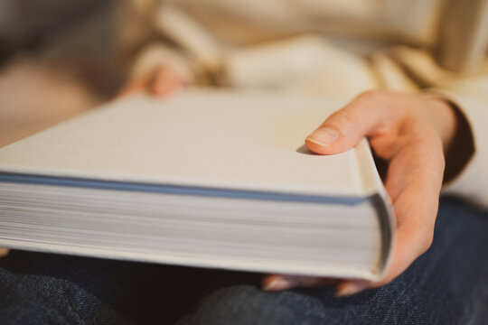 Pages of the white book. Reading literature in the library