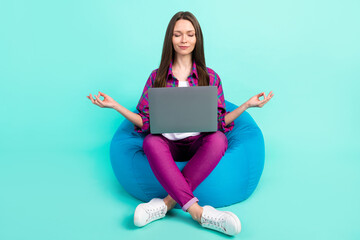 Full size photo of lovely young lady sit on bag meditate with laptop wear shirt trousers isolated...