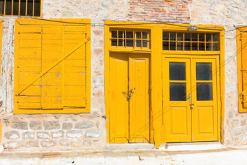 Yellow door frame in Greece Island Hydra Saronikos Gulf - 439313249