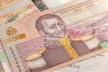 Close up to 25 Gourde or Gourdes of the Republic of Haiti. Paper banknotes of the Caribbean country. Detailed capture of the front art design. Detailed money background wallpaper. Currency bank note