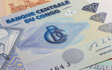 Fototapeta premium Close up to five hundred Francs of the Republic of Congo. Paper banknotes of the African country. Detailed capture of the front art design. Detailed money background wallpaper. Currency bank note
