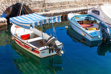 Old beautiful Fishing boats in Hydra island in Greece in Saronikos Gulf - 439313843