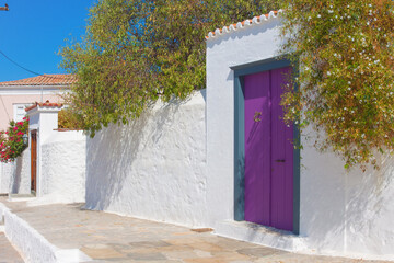 Colorful wooden door frame view in Hydra island, Greece Saronikos Gulf - 439314277