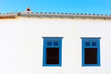 Traditional window frames in greek Island Hudra at saronikos gulf - 439316201