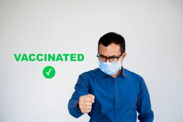 A man stands in hand to show confidence for coronavirus or COVID-19 vaccine, concept to prevent the spread of coronavirus and demonstrate safety after vaccination. health passport, person, by oneself