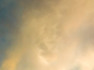 White clouds in the sky reflect the sun as a background.