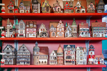 Christmas souvenirs, decor miniature ornament village house, on display at Christmas market in Winter Wonderland in London