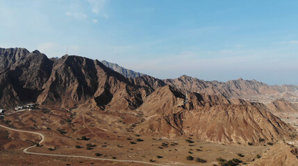 AERIAL. Top view of Road between mountains in UAE