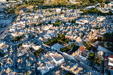 Aerial view of alberobello at sunset, the city of trulli in Puglia. a magical city and a beautiful...
