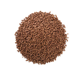 Pile of buckwheat tea granules on white background, top view