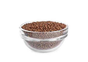 Buckwheat tea granules in glass bowl on white background