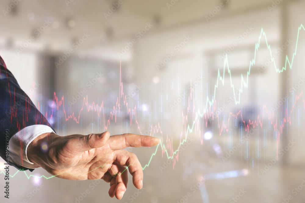 Poster multi exposure of trader hand clicks on virtual abstract financial graph interface on blurred office
