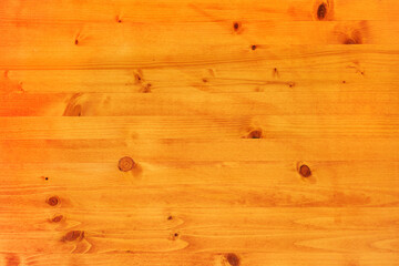 Pinewood board surface as background, texture of wooden planks with wood knots