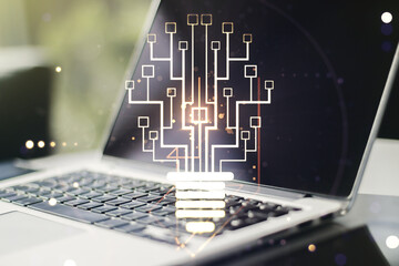 Fototapeta premium Double exposure of creative light bulb hologram with chip on laptop background, idea and brainstorming concept