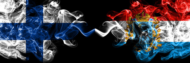 Obraz premium Finland, Finnish vs Russia, Russian, Samara Oblast smoky flags side by side.