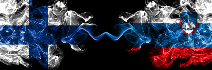 Finland, Finnish vs Slovenia, Slovenian smoky flags side by side.