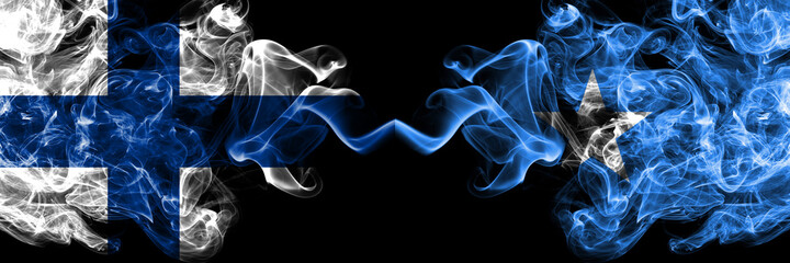 Finland, Finnish vs Somalia, Somali smoky flags side by side.