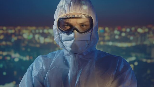 Doctor microbiologist scientist in a protective PPE suit