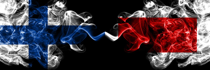 Finland, Finnish vs UAE, United Arab Emirates, Sharjah smoky flags side by side.