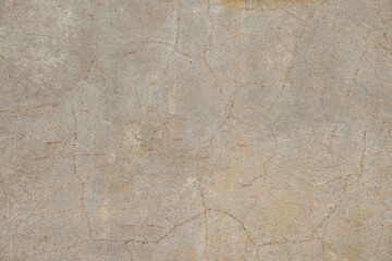 Gray concrete wall with cracks. Gray color background with copy space