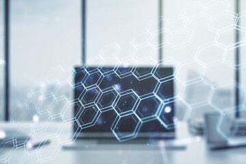 Creative concept of wireless technology with hexagon hologram on modern laptop background. Big data and database concept. Multiexposure
