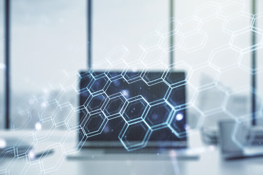 Creative concept of wireless technology with hexagon hologram on modern laptop background. Big data and database concept. Multiexposure