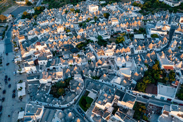 Aerial view of alberobello at sunset, the city of trulli in Puglia. a magical city and a beautiful landscape