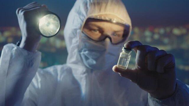 Doctor microbiologist scientist in a protective PPE suit