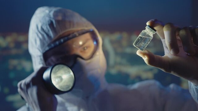 Doctor microbiologist scientist in a protective PPE suit