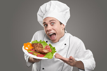 Funny hilarious chef demonstrating delicious dish in restaurant