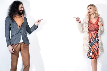 Foto op Canvas Funny hipster couple posing on white background © konradbak
