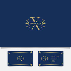 Gold ornamental ribbon on letter X monogram initial logo in blue background with business card template