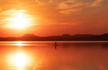 Landscape with a beautiful sunrise on the lake