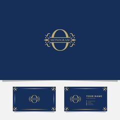 Gold ornamental ribbon on letter O monogram initial logo in blue background with business card template