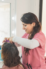 Obraz na płótnie Canvas Adult woman getting a haircut.