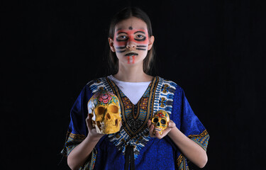 portrait of young mexican girl with skulls
