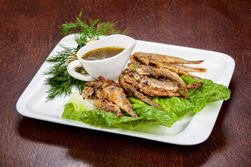 Fried barabulka fish with sauce
