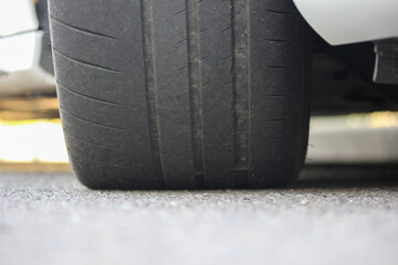 Fototapeta na wymiar Worn car tire on the road