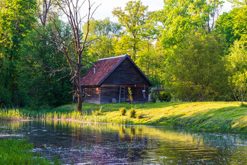 Fairy house on the river and wooden bridge.