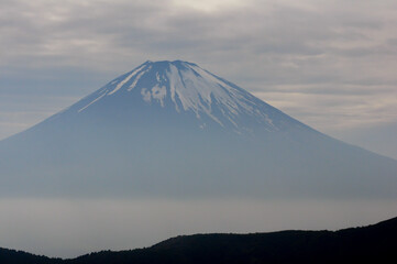 Obraz premium View of Mount Fuji at dusk, from the fumaroles in Mount Hakone, Hakone, Kanagawa Prefecture, Japan. The picture is in landscape view