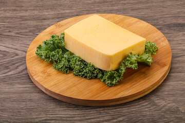 Tasty yelloow Tilsiter cheese brick